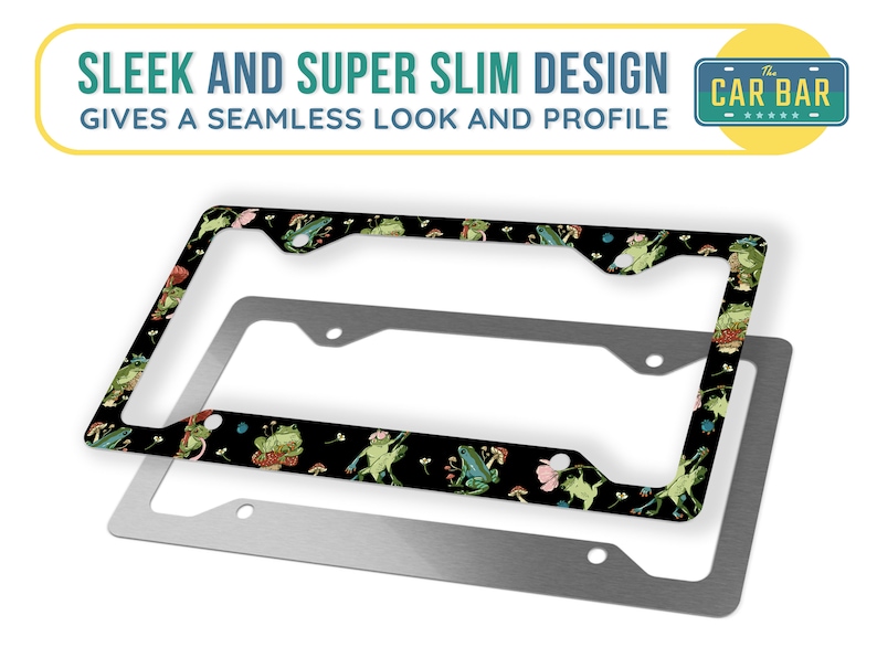 May include: A black and green license plate frame featuring a frog and mushroom design. The frame is made of metal and has a sleek and super slim design. The text "The Car Bar" is printed on the frame.