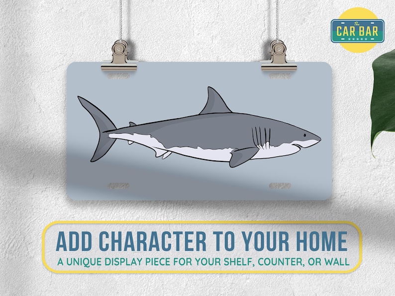 May include: A white great white shark with a gray back and a white belly is swimming to the right. The shark is on a light blue background. The image is a unique display piece for your shelf, counter, or wall.