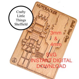 May include: A wooden nutcracker craft kit with the text "Build Your Own" and "Nutcracker" on the top. The kit includes a nutcracker design with a crown and mustache. The text "3mm & 4mm" and "SVG Instant Digital Download" is also included on the kit.