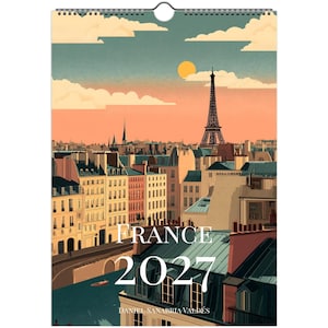 Puede incluir: Un calendario de pared con una ilustración estilizada del horizonte de París al atardecer con la Torre Eiffel, edificios y un río. El texto dice FRANCE 2027 y DANIEL SANABRIA VALDÉS. La paleta de colores incluye tonos melocotón, azul y crema.