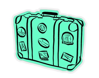 May include: A teal blue suitcase with black accents and various travel stickers. The stickers include images of the Eiffel Tower, the Arc de Triomphe, a globe, and the words "Paris" and "Mexico".