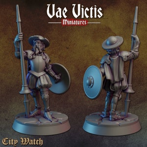 May include: A 3D printed miniature of a city watch soldier wearing armor and holding a spear and shield. The miniature is painted in a gray color and is standing on a round base. The text "City Watch" is printed on the base.