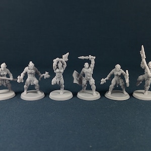 May include: Six unpainted miniature figures of orcs, each holding a weapon and standing on a round base. The figures are made of a gray plastic material.