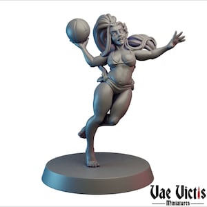 May include: A gray 3D printed miniature of a female figure wearing a bikini and holding a beach ball. The figure is posed in a dynamic, leaping position. The miniature is set on a round base.
