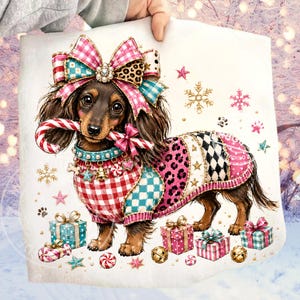 May include: A long-haired dachshund illustration wearing a multi-patterned sweater with red gingham, teal checkers, pink leopard print, and black diamonds. The dog has a large pink bow on its head and holds a candy cane. Surrounded by gift boxes.