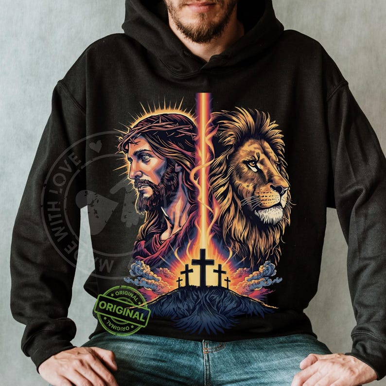 May include: Black hoodie featuring a graphic of Jesus Christ and a lion, with a cross and a beam of light. The design includes the text "ORIGINAL" and "WITH LOVE".