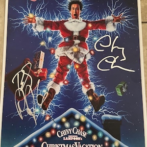 Chevy Chase and Bevery D&#39;Angelo dual signed autographed Christmas Vacation poster Beckett Authenticated