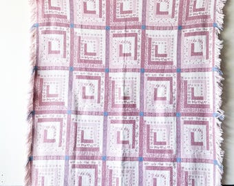 Pink and blue tapestry blanket with fringe