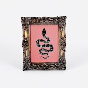 Whimsical Black Snake Painting on Pink – Vintage Ornate Gold Frame – Gothic Boho Decor, Mystical Wall Art