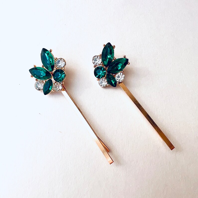 a set of 2 vintage inspired emerald green with rhinestone jewel accents and gold base bobby pin set. Special occasion, gift idea, hair jewelry.