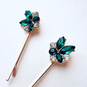 a set of 2 vintage inspired emerald green with rhinestone jewel accents and gold base bobby pin set. Special occasion, gift idea, hair jewelry.