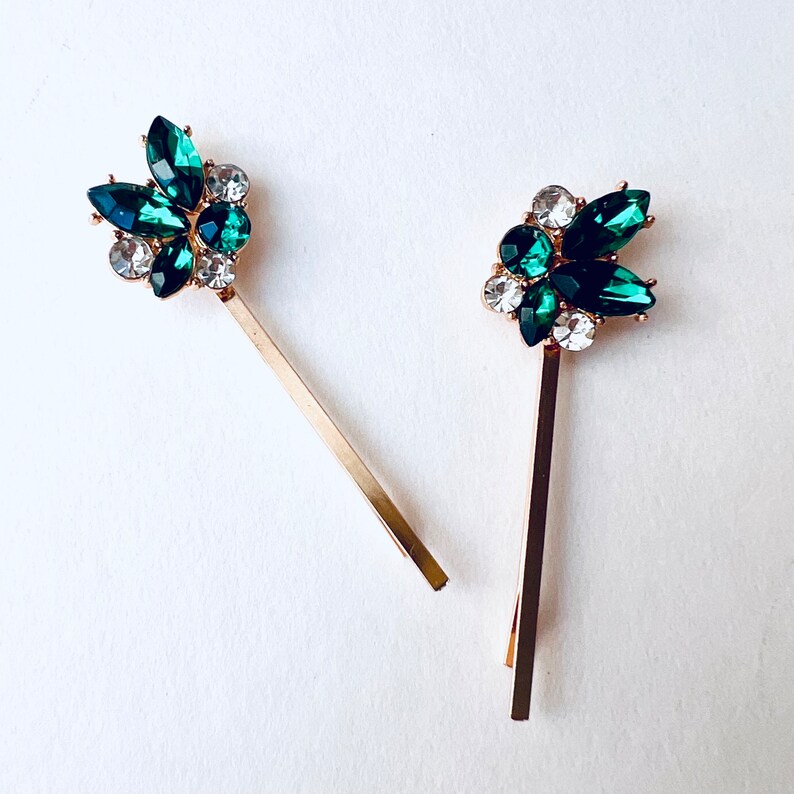 a set of 2 vintage inspired emerald green with rhinestone jewel accents and gold base bobby pin set. Special occasion, gift idea, hair jewelry.