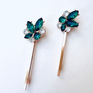 a set of 2 vintage inspired emerald green with rhinestone jewel accents and gold base bobby pin set. Special occasion, gift idea, hair jewelry.