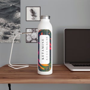 May include: White stainless steel water bottle with a colorful label that says "KETAMINE 0.2-2.5 MG/KG/HR".