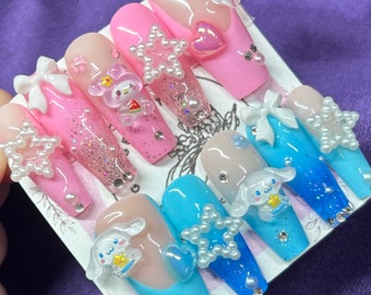 my melody nails/nails/ pressons/ Sanrio nails/ Sanrio/ pink nails/ pink/ blue/ blue nails/ canela roll nails/ canela roll/ glitter nails