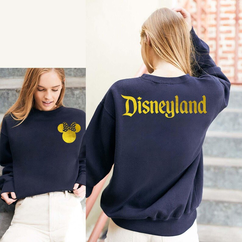 Navy Disneyland Sweatshirt With Gold Letter featuring a Minnie Mouse design on the front and Disneyland text on the back, perfect for Disney fans. This cozy Disney Crewneck is great for trips or casual wear.