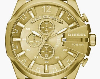 May include: A gold-toned chronograph wristwatch with a round face and a stainless steel band. The watch face features a gold background with black markings and hands. The watch face also features the text "DIESEL 10BAR" and "ONLY THE BRAVE".