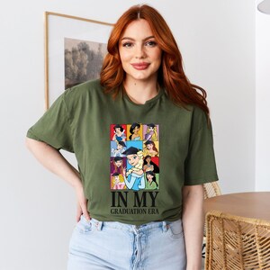 a woman with red hair wearing a green shirt