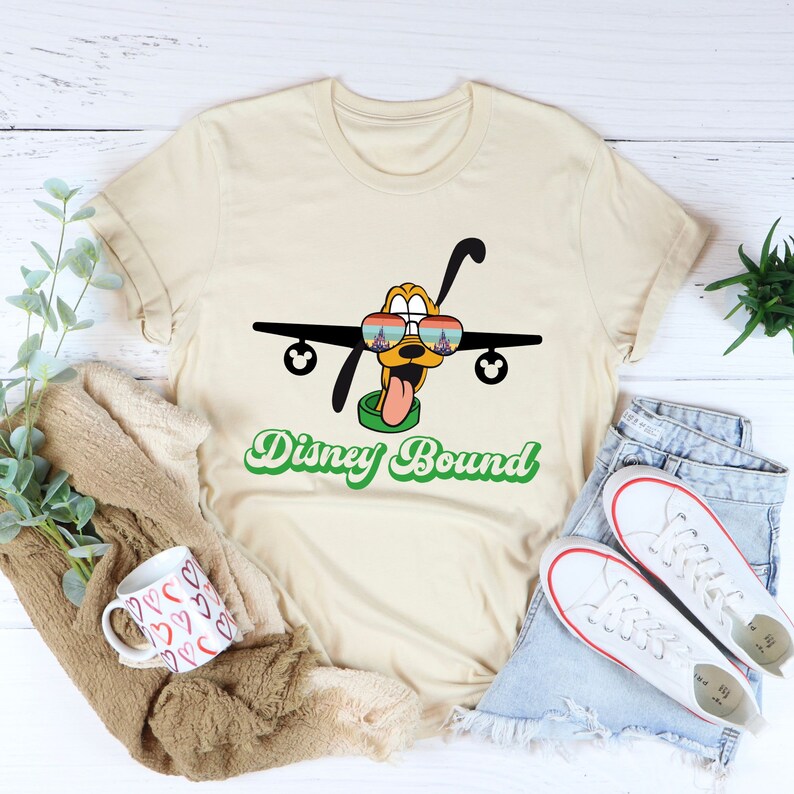 a t - shirt that says disney bound with a plane on it