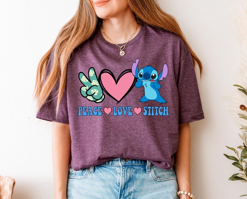 A woman wearing a purple t-shirt with a graphic design featuring a character from the Lilo & Stitch movie franchise, along with the text "Peace Love Stitch".