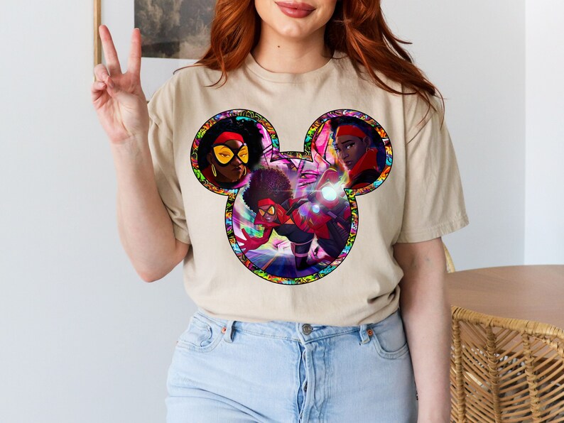 a woman with red hair wearing a mickey mouse t - shirt