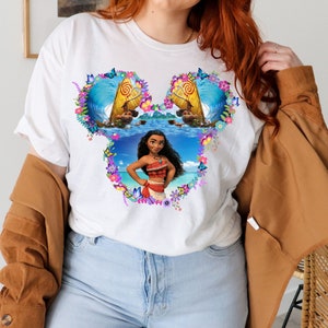 a woman wearing a white shirt with a picture of a woman on it