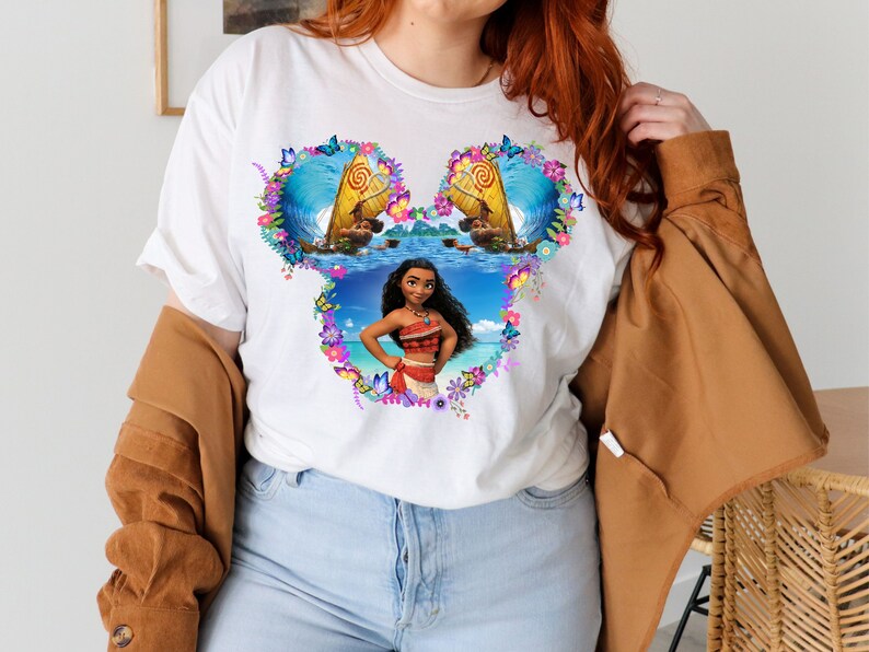 a woman wearing a white shirt with a picture of a woman on it