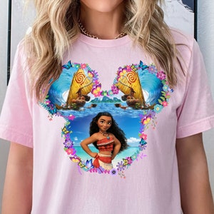 a woman wearing a pink shirt with a picture of a woman on it