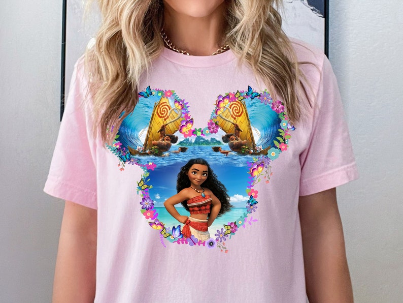 a woman wearing a pink shirt with a picture of a woman on it