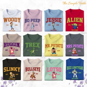 a bunch of t - shirts with cartoon characters on them