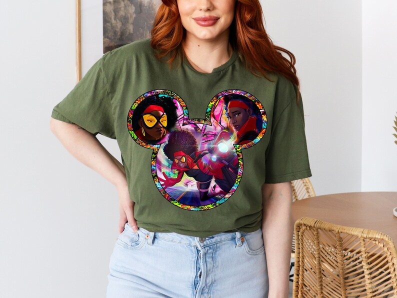 a woman with red hair wearing a mickey mouse t - shirt
