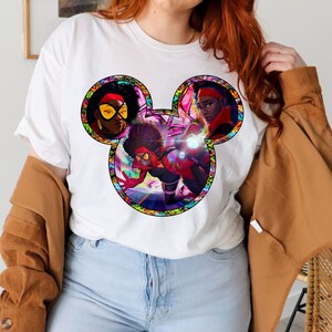 a woman with red hair wearing a mickey mouse shirt
