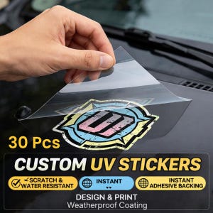 May include: A hand peeling a clear UV sticker from a car's hood. The sticker has a colorful design with the letter "U" in the center. Text on the sticker reads "CUSTOM UV STICKERS", "SCRATCH & WATER RESISTANT", and "INSTANT ADHESIVE BACKING".