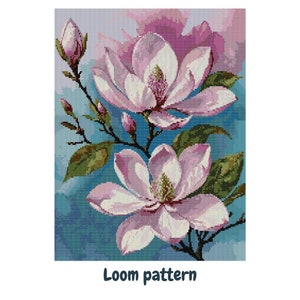 May include: A loom pattern featuring two pink magnolia flowers with green leaves and stems on a blue background. The text "Loom pattern" is at the bottom of the image.