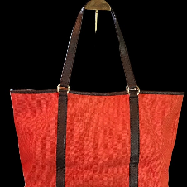 Michael Kors canvas and brown leather XL tote orange.