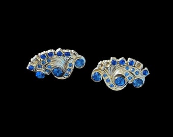 Vintage blue rhinestone twist back earrings.