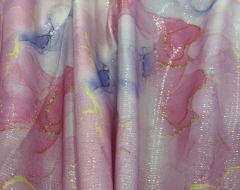 May include: Pink and white fabric with a sparkly, iridescent finish. The fabric has a marbled pattern with gold accents.