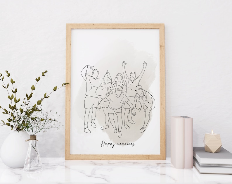 May include: A framed black and white line drawing of a group of friends posing together. The drawing is on a white background with a light brown watercolor wash behind the figures. The text "Happy memories" is written below the drawing.