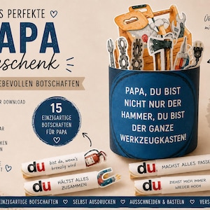 May include: A blue cylindrical gift box with a toolbox theme, featuring miniature tools and the text "Papa, Du bist nicht nur der Hammer, du bist der ganze Werkzeugkasten!" Also includes small message scrolls.