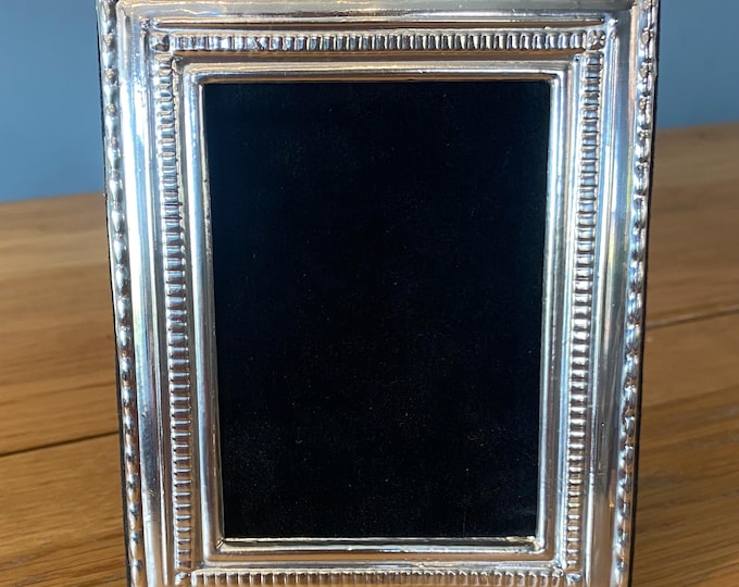 Sterling Silver photograph frame. Fully hallmarked in London. Beautiful black velvet back. Landscape or portrait.