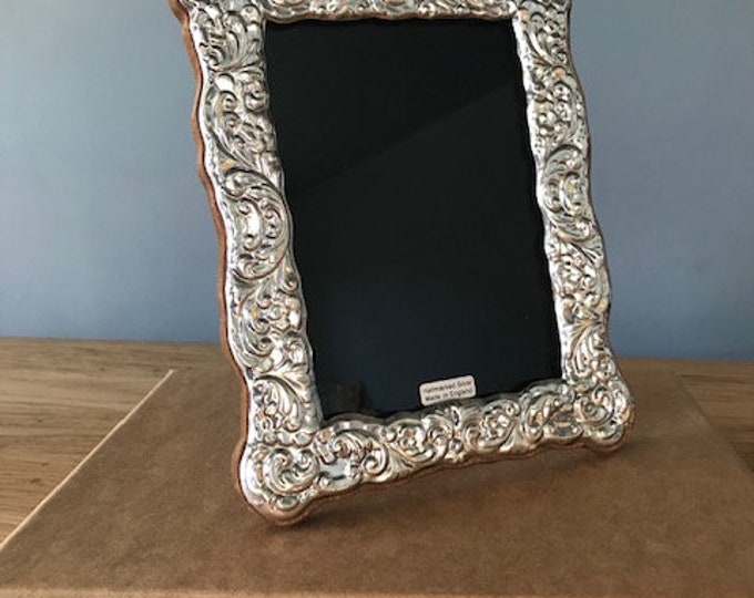 Sterling Silver 925 Photograph frame. Fully Hallmarked in London. Picture size 6”x4” Hand made in England. Beautiful wood back.