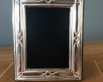 Sterling silver 925 Photograph Frame. Fully Hallmarked in London. Picture size approx 4” x 2.75” with black velvet back.