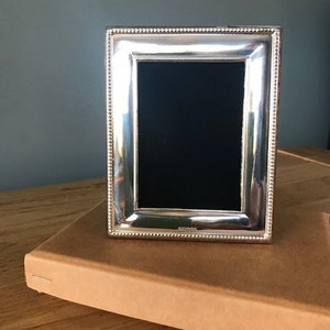 Solid Silver Photograph Frame. Fully Hallmarked in London. Picture size 4” x 2.75”
