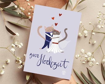 May include: A greeting card with a light purple background features a cartoon illustration of two cats embracing. The cat on the left is wearing a blue suit, and the cat on the right is in a white dress. The German text "zur Hochzeit" is written in a script font.