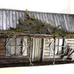 Fachada da parede da cabana de Evil Dead Ash Knowby