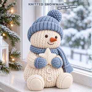 May include: A cream-colored knitted snowman figurine featuring a blue ribbed hat with a pom-pom, a matching blue scarf, and blue mittens. The snowman holds a cream star, has two buttons on its torso, and displays the text KNITTED SNOWMAN 3D STL-MF MODEL.