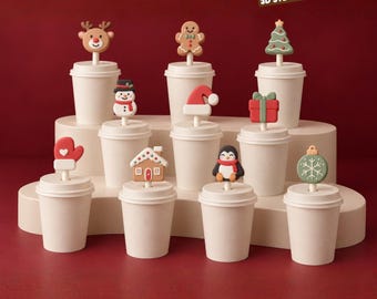 May include: A set of ten Christmas straw toppers featuring a reindeer, gingerbread person, tree, snowman, Santa hat, gift box, mitten, house, penguin, and ornament, each attached to a white cup lid. Text reads: CHRISTMAS STRAW TOPPER PACK - 10 MODEL.
