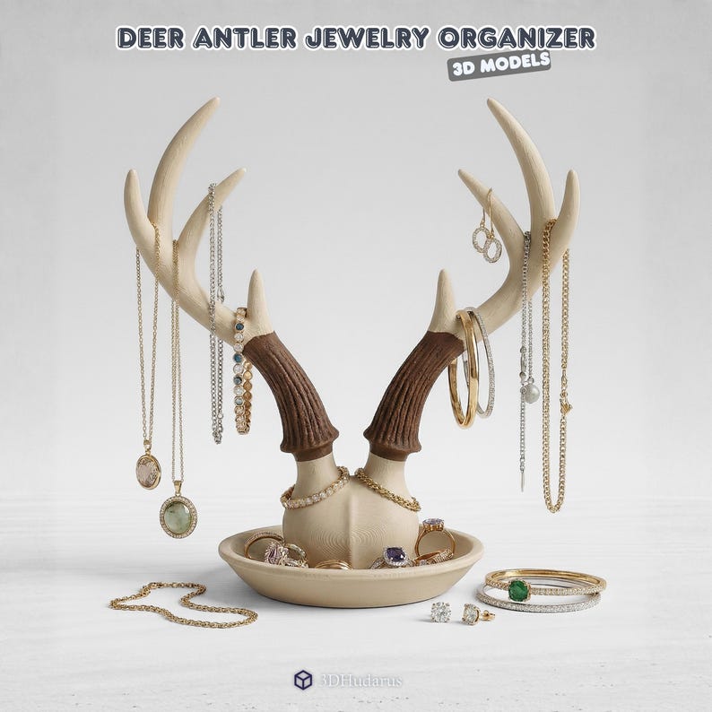 May include: A cream-colored deer antler jewelry organizer with brown antler accents. The organizer holds necklaces, earrings, rings, and bracelets. The text "DEER ANTLER JEWELRY ORGANIZER" is at the top.