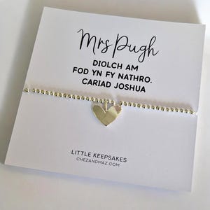 May include: A rustic wooden sign with the text "Welcome to our home" in a handwritten style. The sign features a distressed finish and a simple, inviting design, perfect for a front porch or entryway.