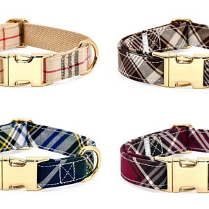 May include: Four dog collars with plaid patterns in different color combinations. The collars have gold-colored buckles and D-rings.